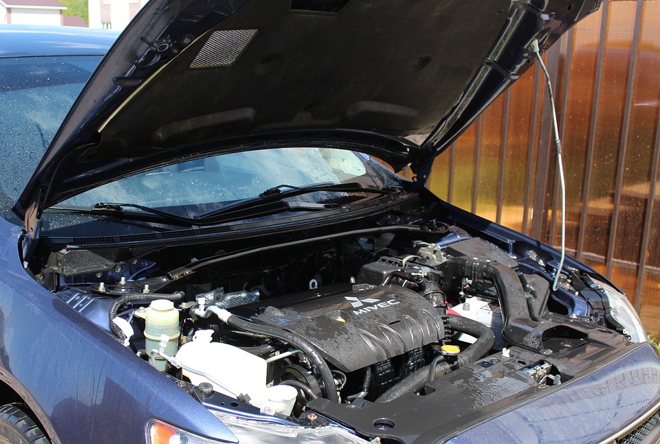 A car hood opened and ready for DIY car repairs.